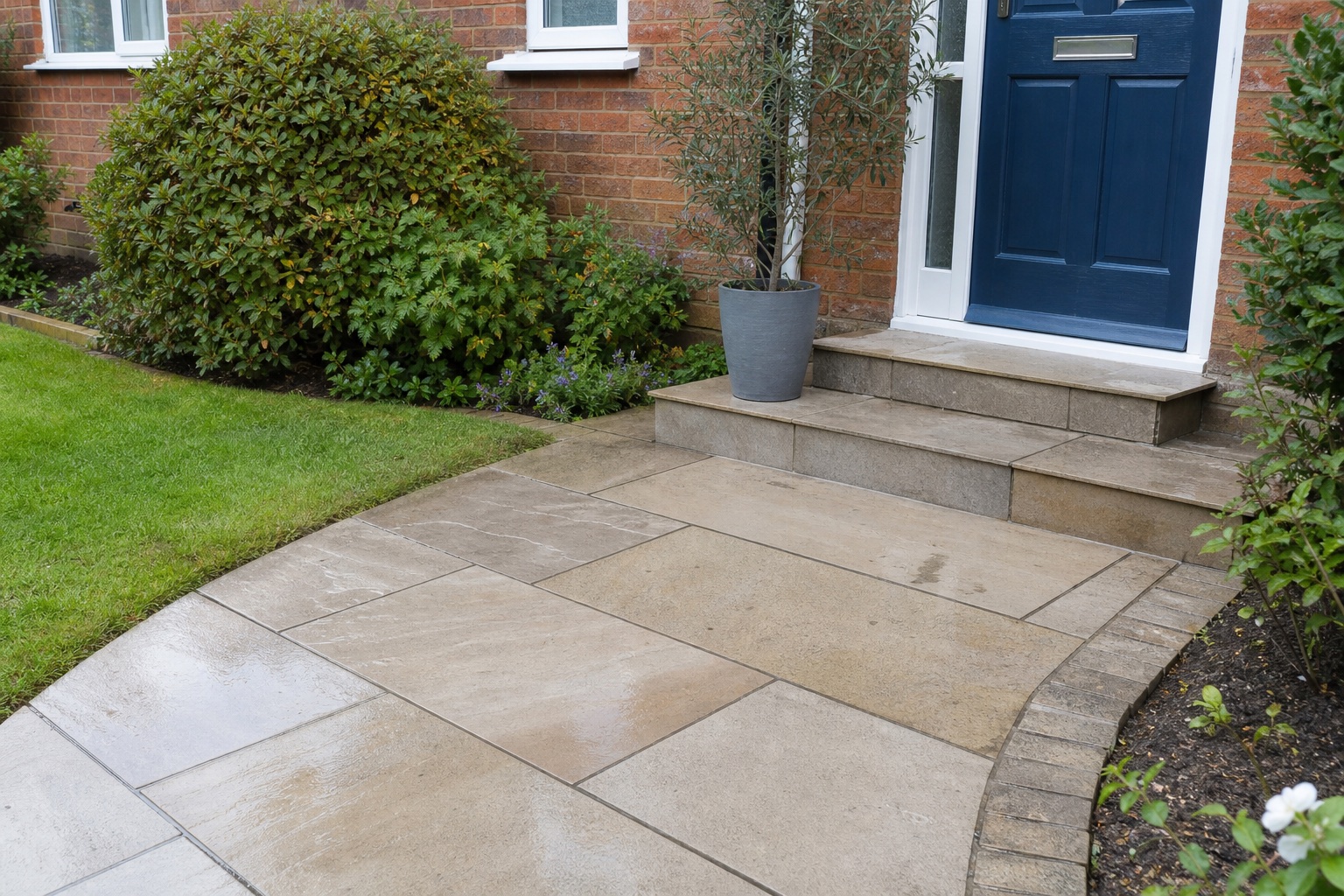 Bright clean front path and entrance paving after pressure washing